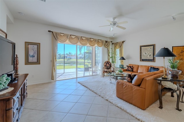 living room with ceiling fan and light tile patterned floors