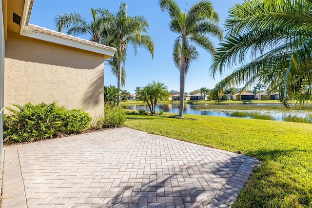 view of patio featuring a water view