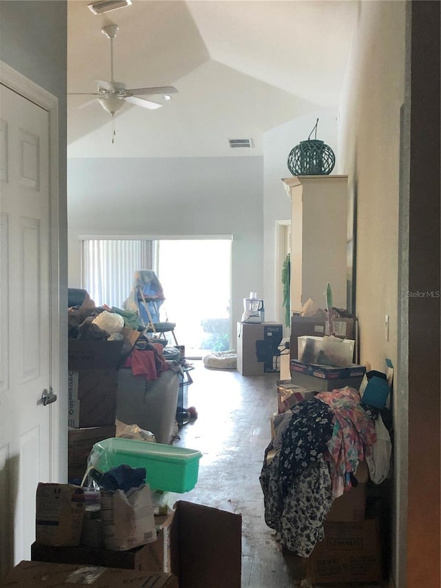 interior space with ceiling fan and lofted ceiling