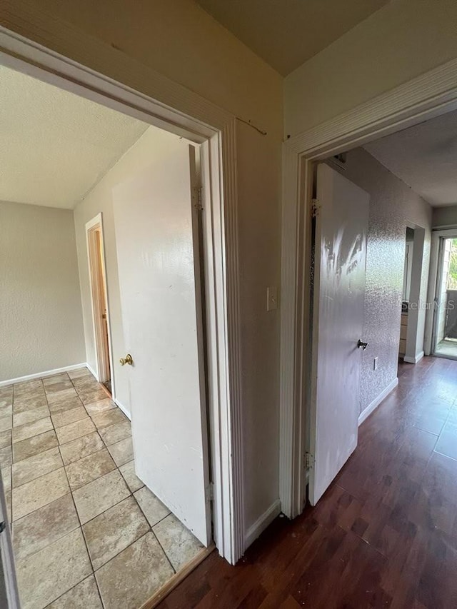 corridor featuring light hardwood / wood-style floors