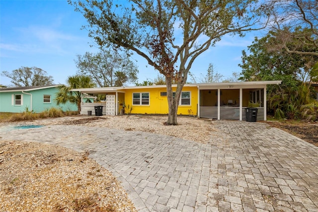 single story home with a carport