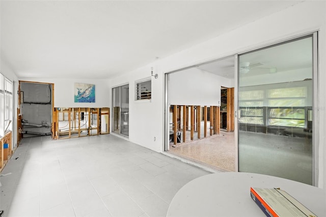 spare room with plenty of natural light and ceiling fan