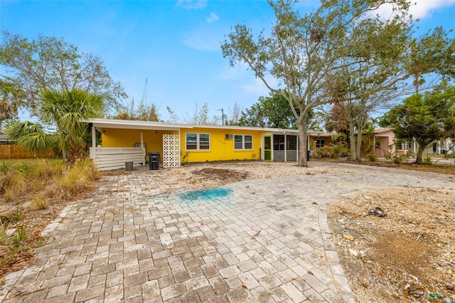 rear view of house featuring a carport