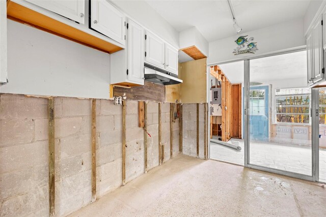 kitchen featuring track lighting and white cabinets