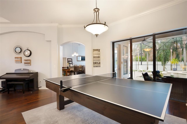 playroom featuring a notable chandelier, crown molding, and dark hardwood / wood-style floors