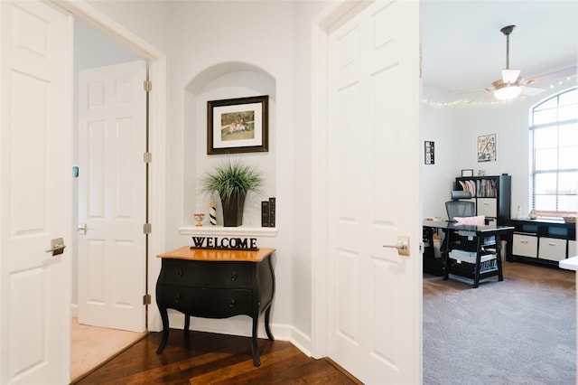 hallway with dark carpet