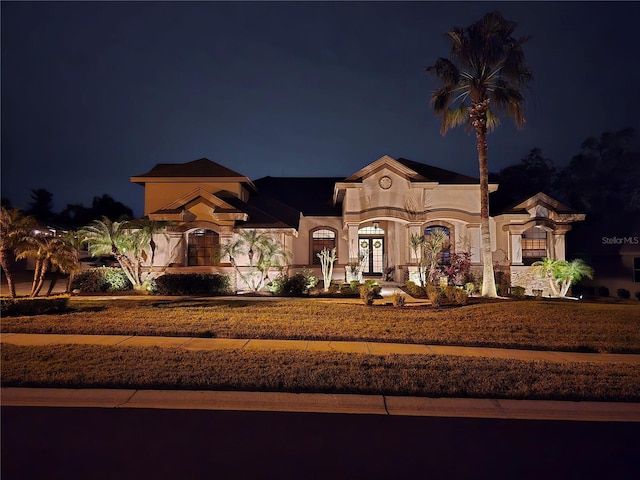 mediterranean / spanish house featuring french doors