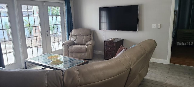 living room featuring light hardwood / wood-style floors and french doors