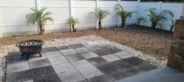 view of patio / terrace featuring an outdoor fire pit