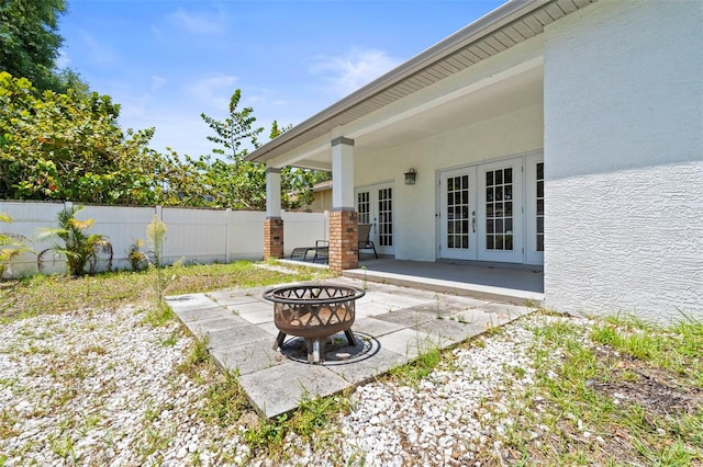 3611 19th St N, Saint Petersburg, FL 33713 - view of patio / terrace with french doors and a fire pit