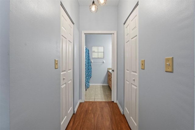 3611 19th St N, Saint Petersburg, FL 33713 - corridor featuring baseboards and dark wood-type flooring