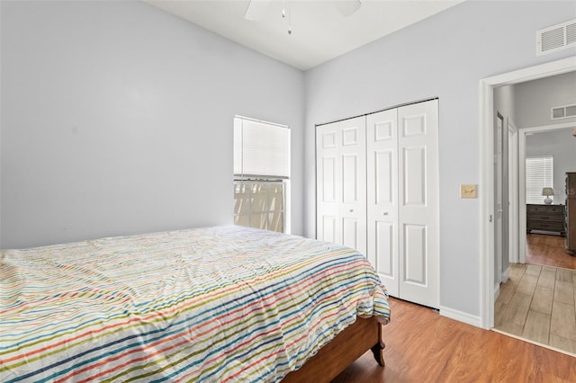 3611 19th St N, Saint Petersburg, FL 33713 - bedroom with wood finished floors, a closet, baseboards, and a ceiling fan