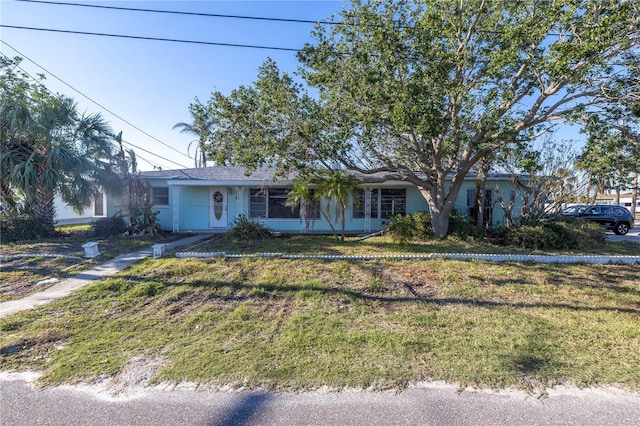 single story home with a front yard