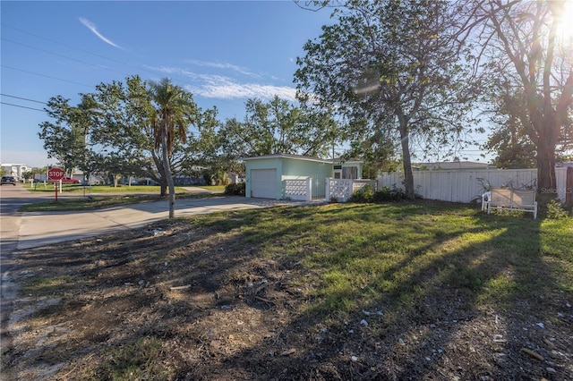 view of yard featuring a garage