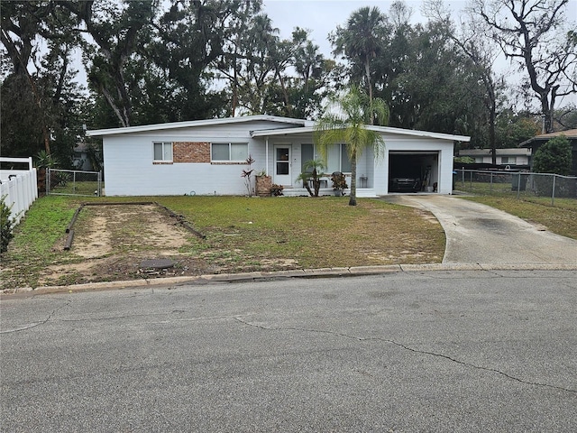 view of front of home with a garage and a front yard