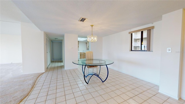 interior space with light tile patterned flooring and a chandelier