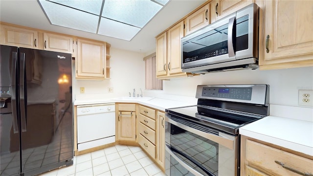 kitchen with sink, light brown cabinets, and appliances with stainless steel finishes