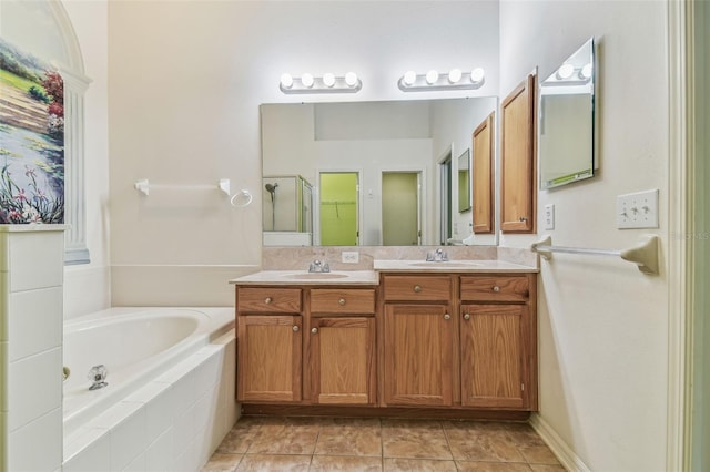 bathroom featuring tile patterned floors, vanity, and plus walk in shower