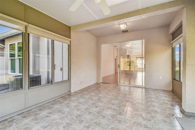 interior space featuring ceiling fan