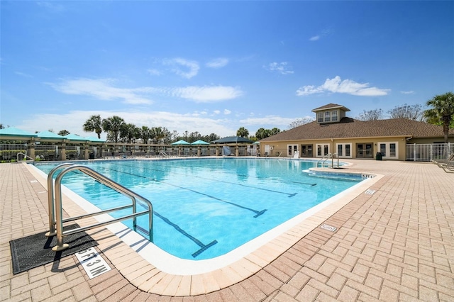 view of swimming pool with a patio area