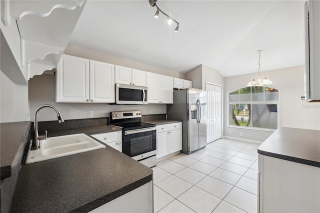 kitchen featuring sink, white cabinets, pendant lighting, and appliances with stainless steel finishes