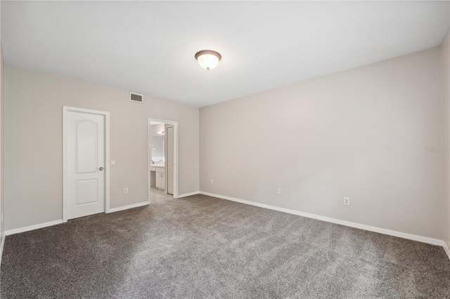 unfurnished room featuring light carpet