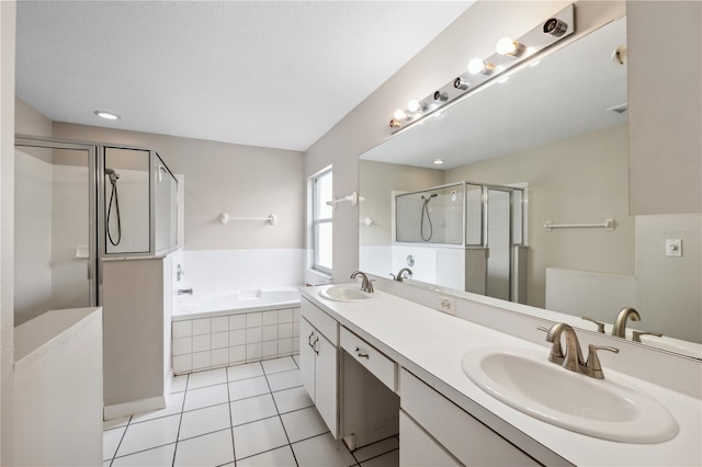 bathroom featuring tile patterned flooring, vanity, and independent shower and bath