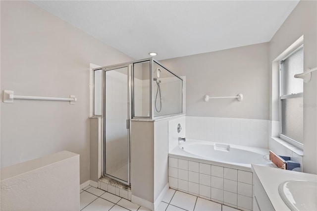 bathroom with tile patterned flooring, vanity, and shower with separate bathtub