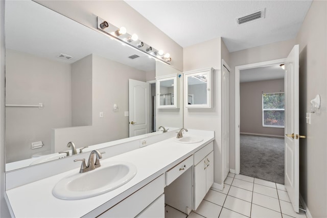 bathroom with vanity and tile patterned floors