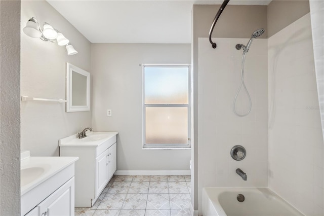 bathroom featuring vanity, tiled shower / bath, and a wealth of natural light