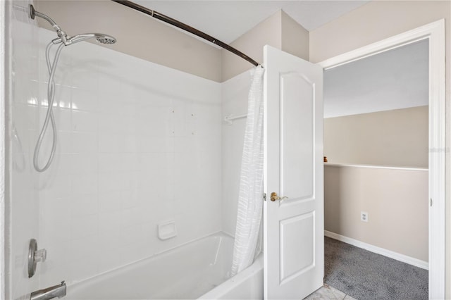 bathroom with shower / bathtub combination with curtain