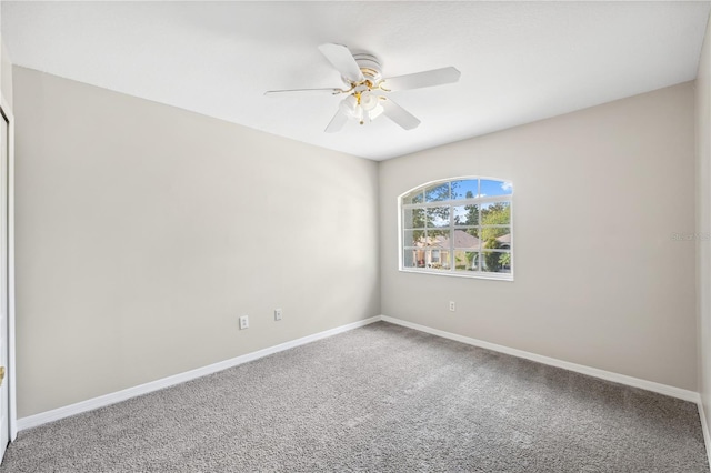 unfurnished room with ceiling fan and carpet floors