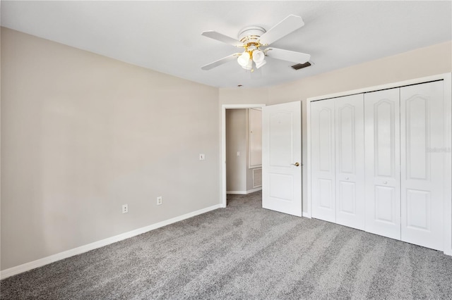 unfurnished bedroom featuring carpet floors, a closet, and ceiling fan