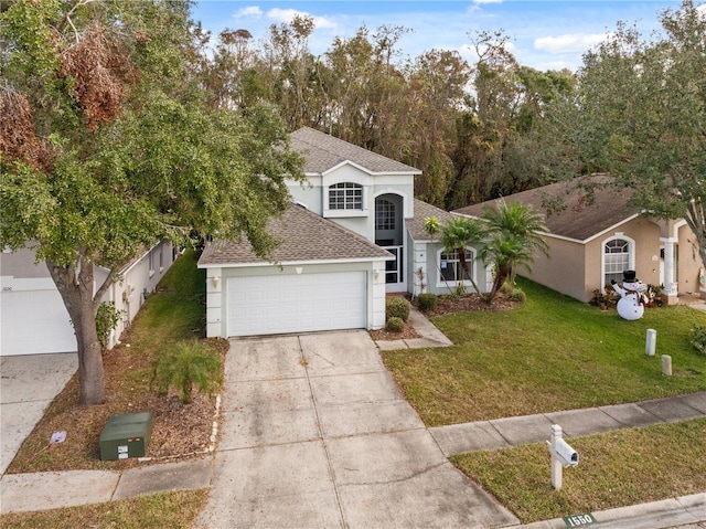 view of front of house featuring a garage and a front yard