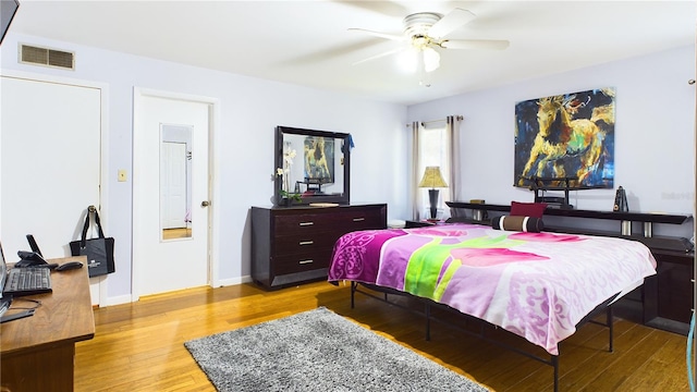 bedroom with ceiling fan and light hardwood / wood-style flooring