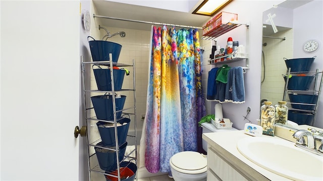 bathroom featuring a shower with curtain, toilet, and vanity