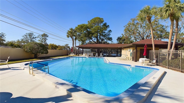 view of swimming pool featuring a patio area