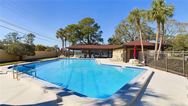 view of swimming pool with a patio