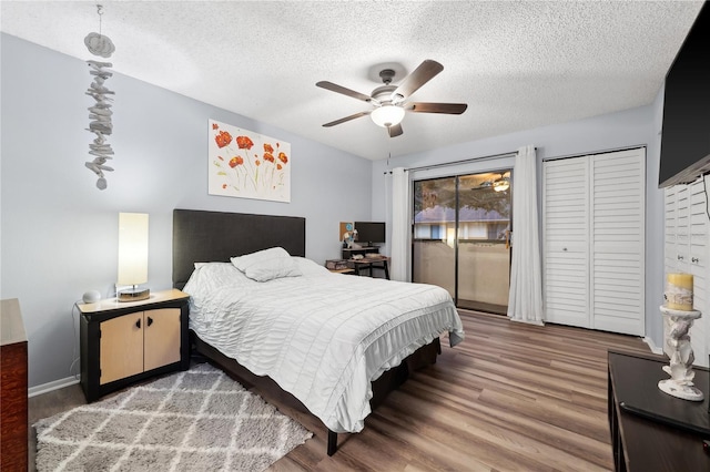 bedroom featuring ceiling fan, a textured ceiling, and hardwood / wood-style flooring