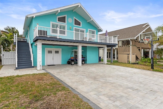 coastal inspired home with a front lawn