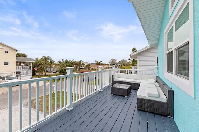 wooden deck with an outdoor living space