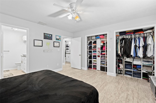 bedroom with ensuite bathroom, a closet, ceiling fan, and light wood-type flooring