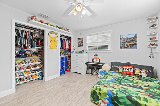 bedroom featuring ceiling fan, light hardwood / wood-style flooring, and a closet