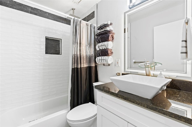 full bathroom with vanity, toilet, and shower / bath combo with shower curtain