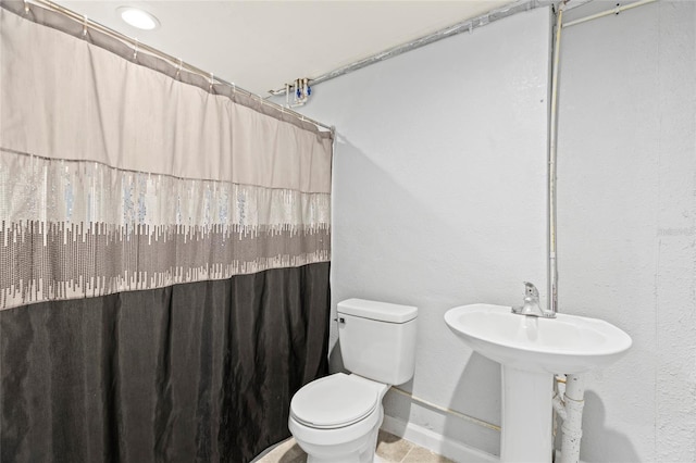 bathroom with toilet and walk in shower