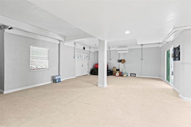 basement featuring a wall mounted AC