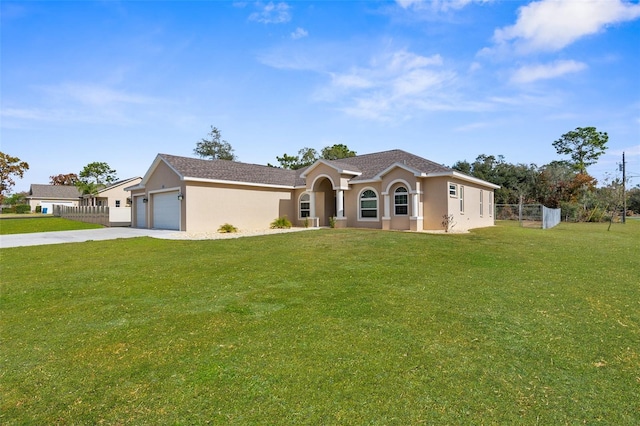 view of front of home with a front yard and a garage