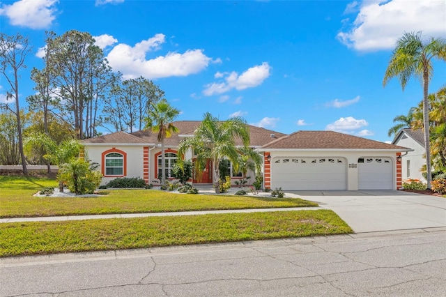 view of front of home featuring a garage and a front lawn