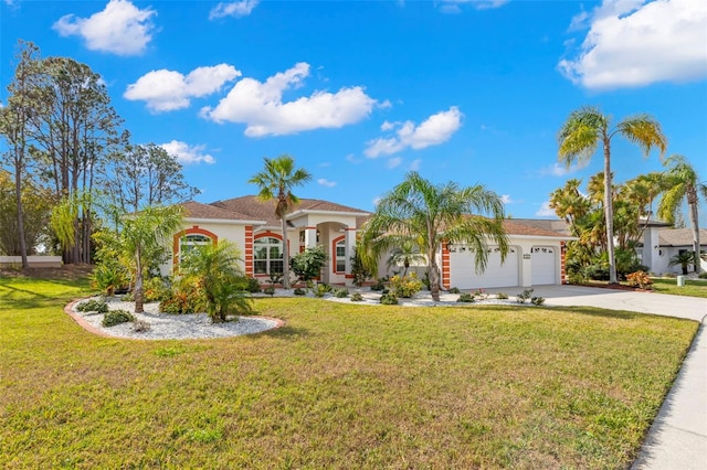 view of front of property featuring a garage and a front lawn