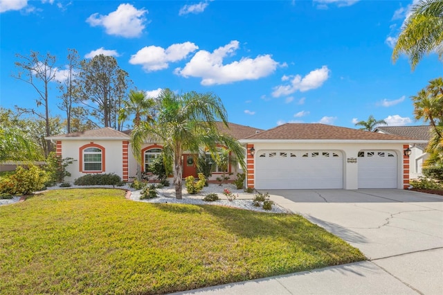 view of front of house featuring a front yard and a garage